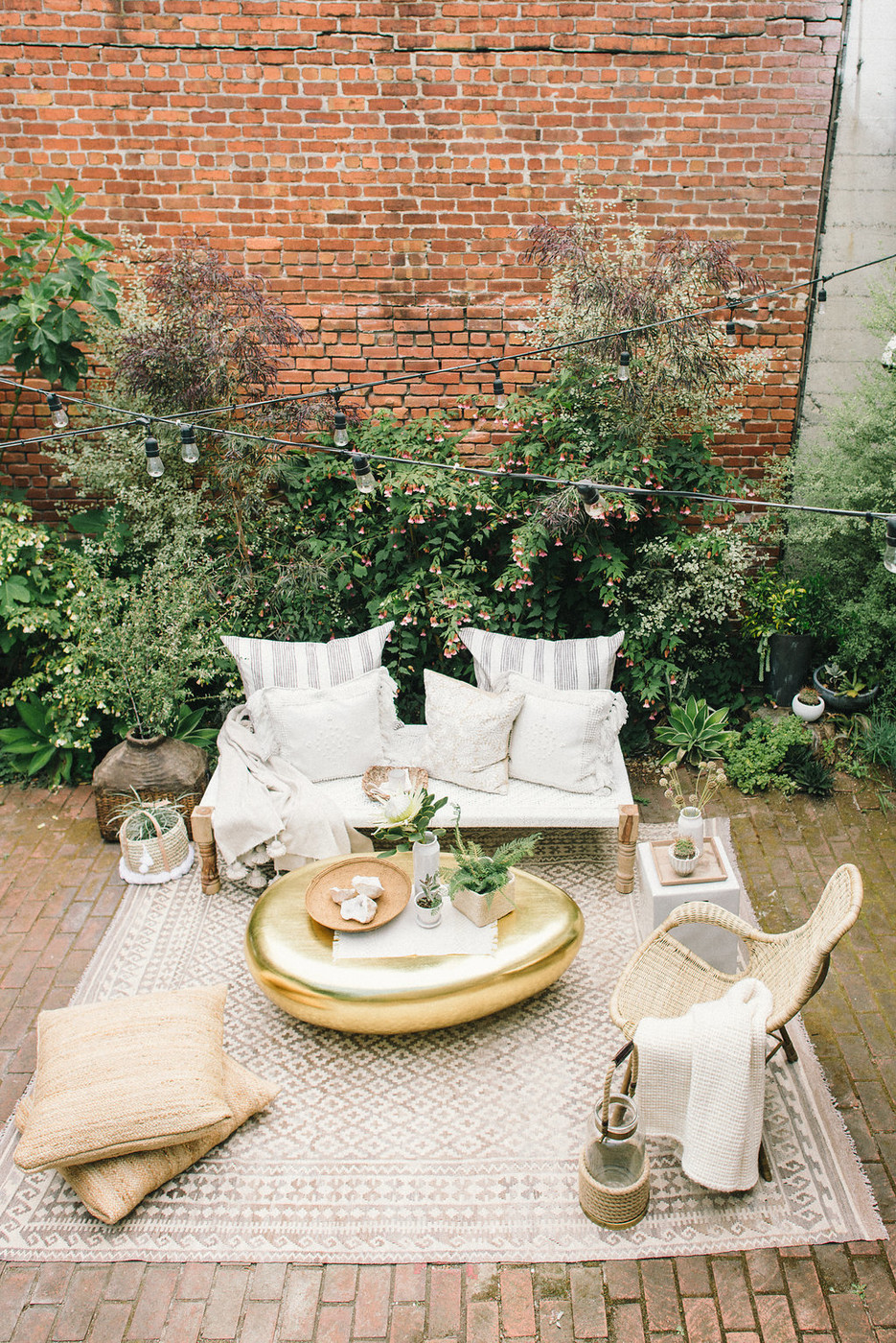 Patio with overhead lights (photo via Lonny)