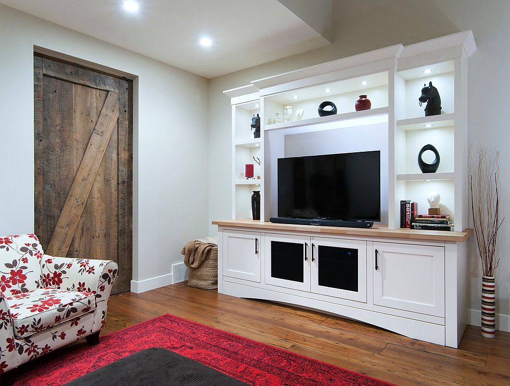 Reclaimed barn door for the beach style home theater [Design: Bow Valley Kitchens / Bob Young Photography]