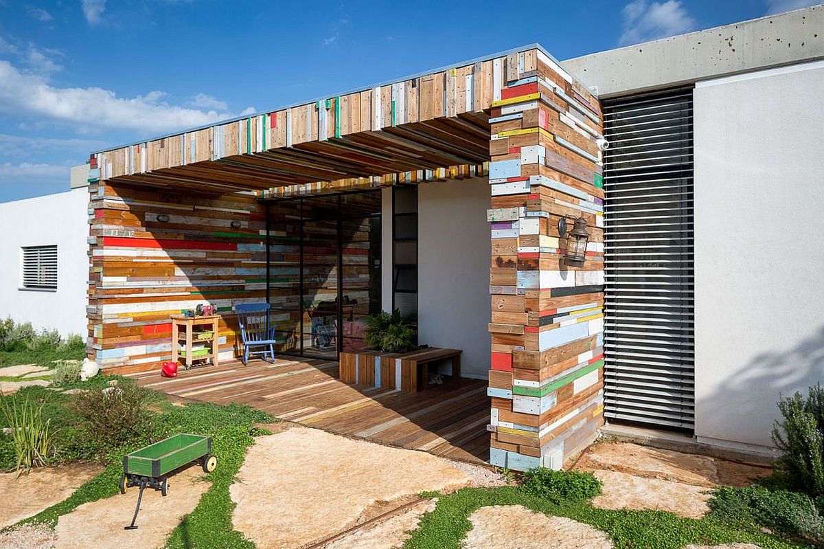 Reclaimed wooden planks shape a gorgeous patio and outdoor hangout