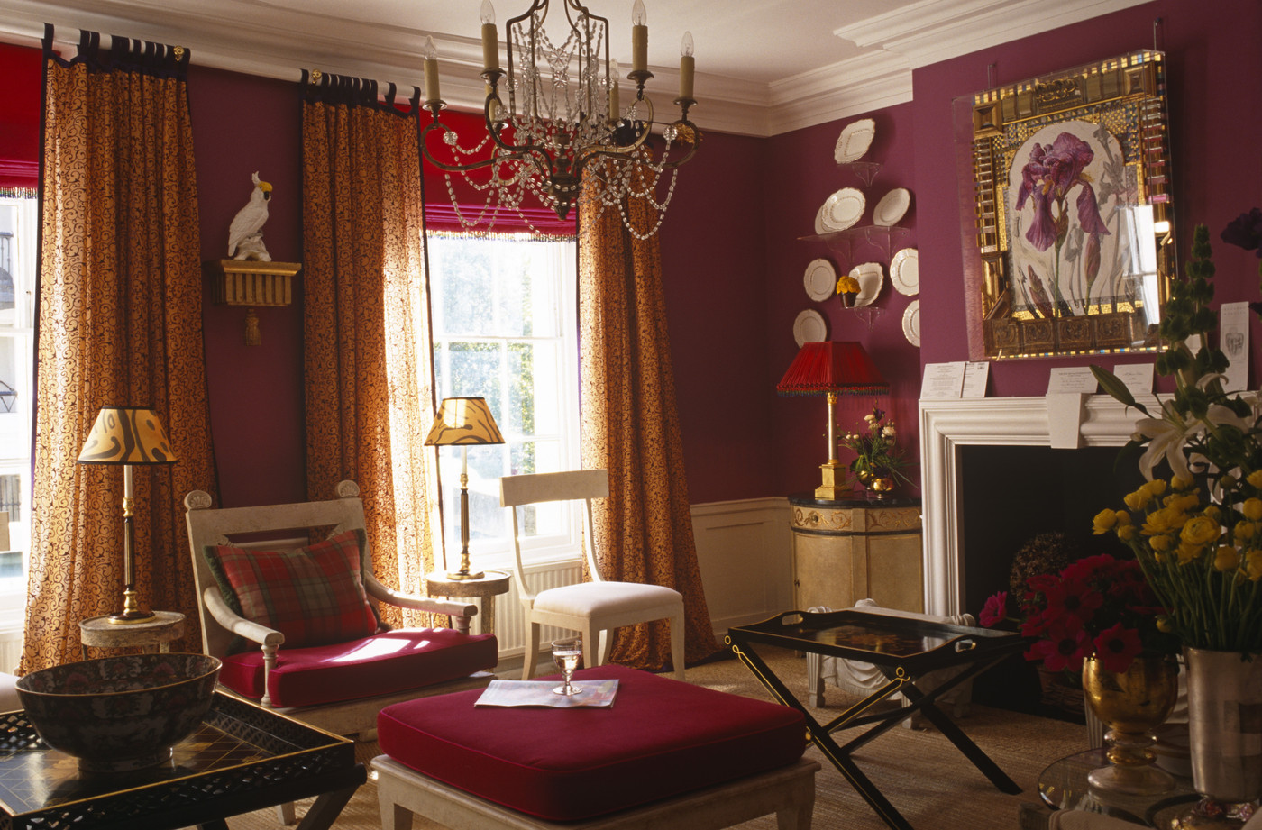 Red drawing room with a chandelier