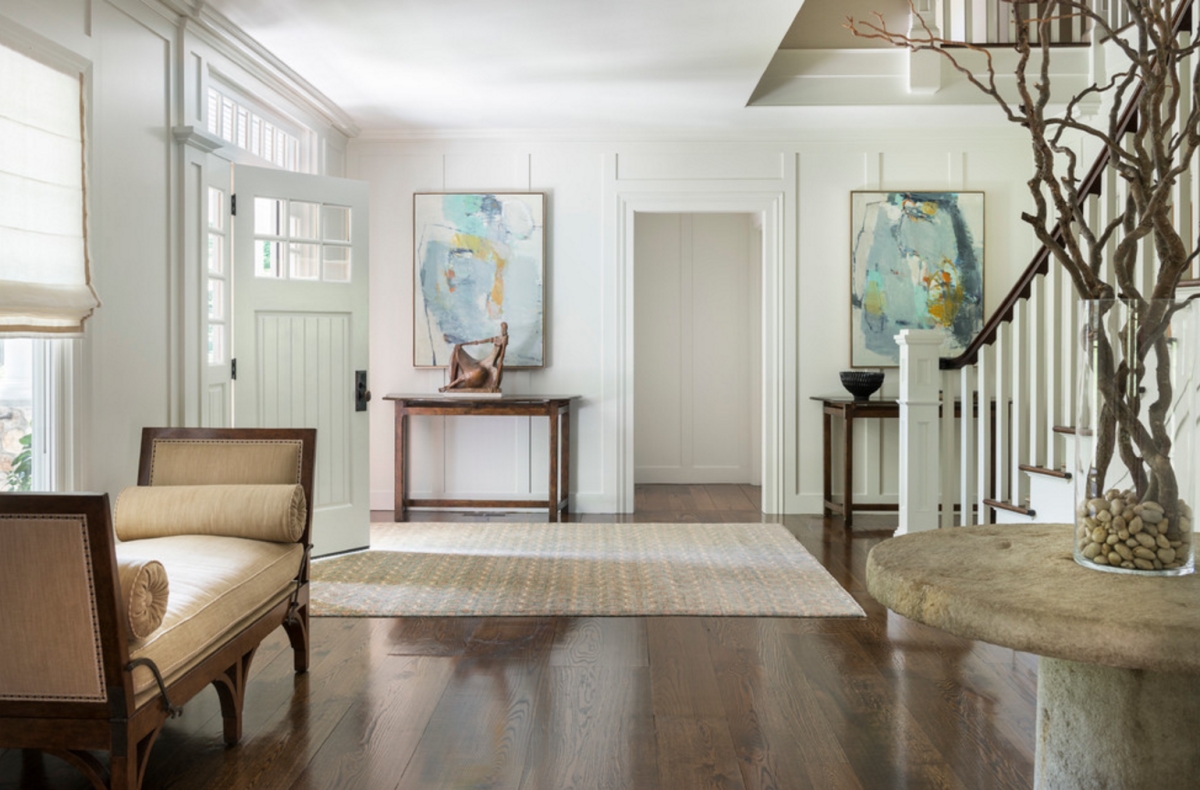 Sculptural arrangement on a foyer table via Hollester Interiors