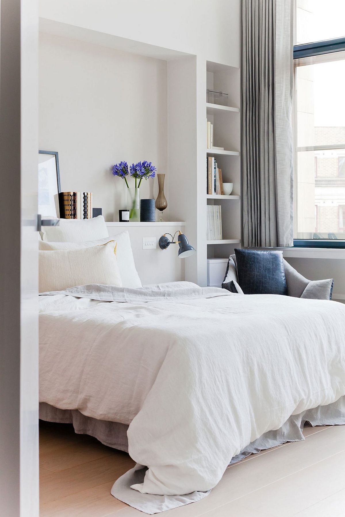 Serene and stylish bedroom in white of the London penthouse