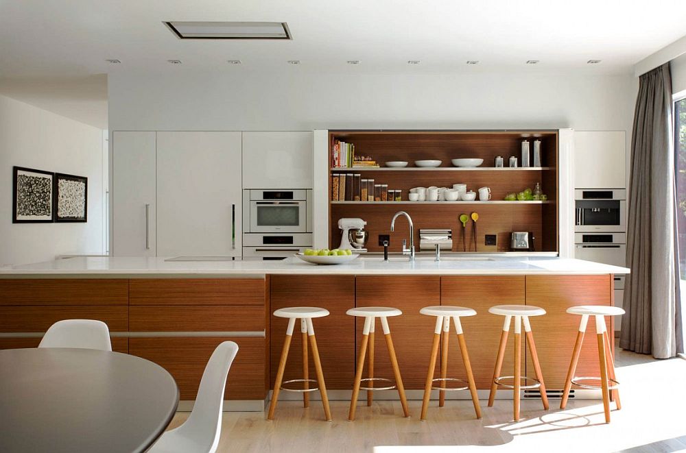 Shelves, kitchen island and bar stools bring warmth of wood to the contemporary living area