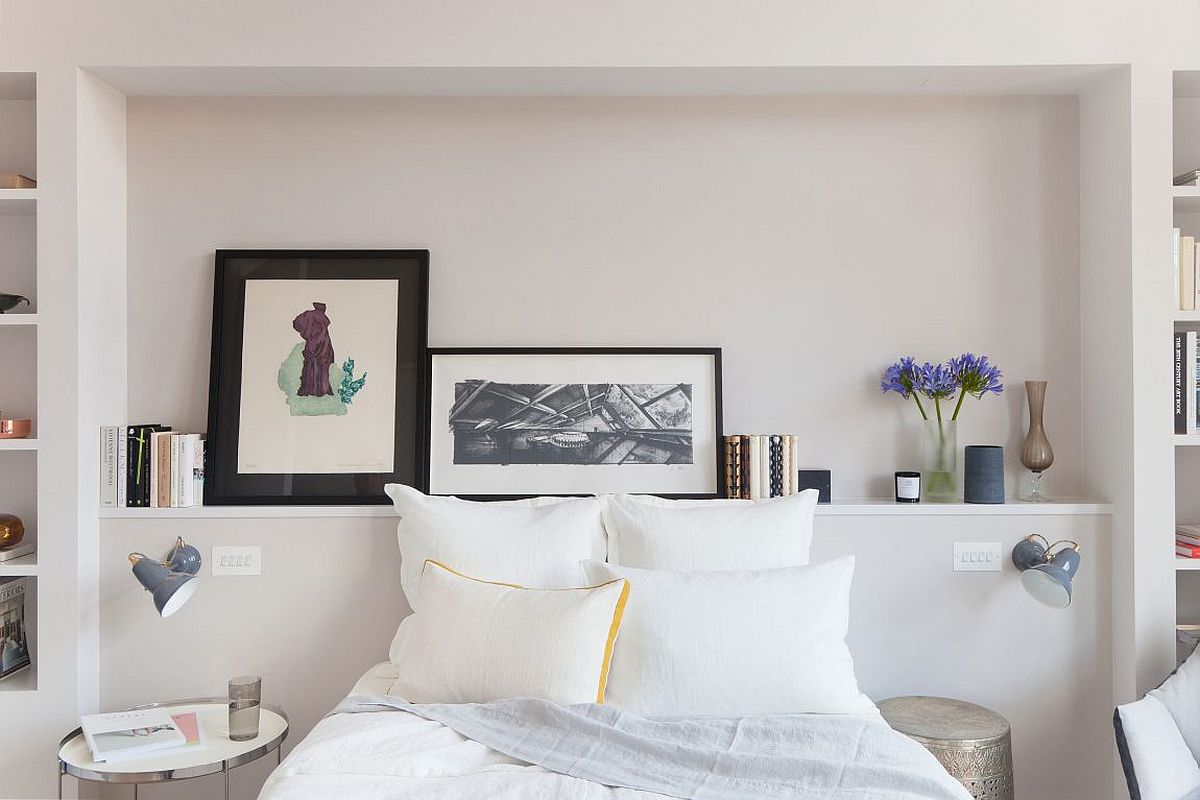 Sleek shelf above the headboad displays art work and holds books