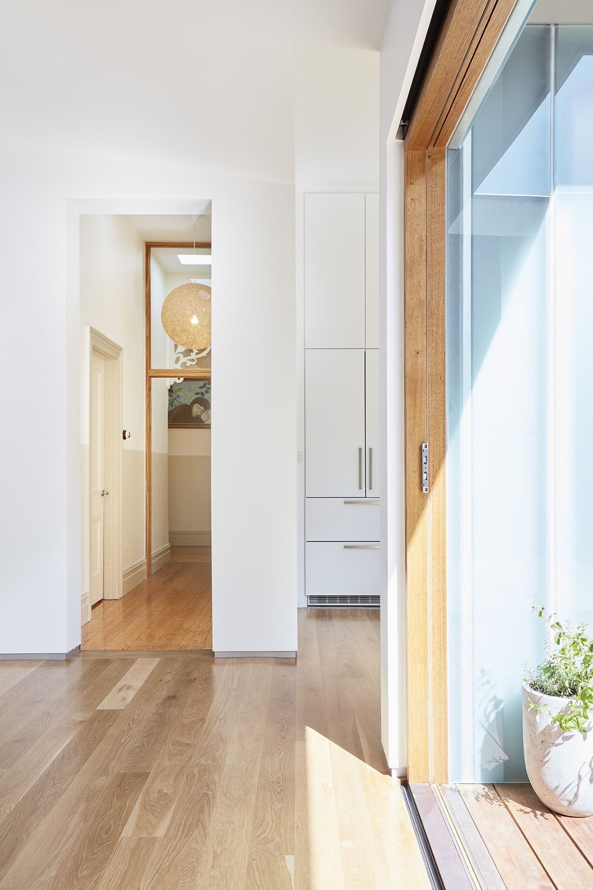 Sliding glass doors connect the interior with the outdoors