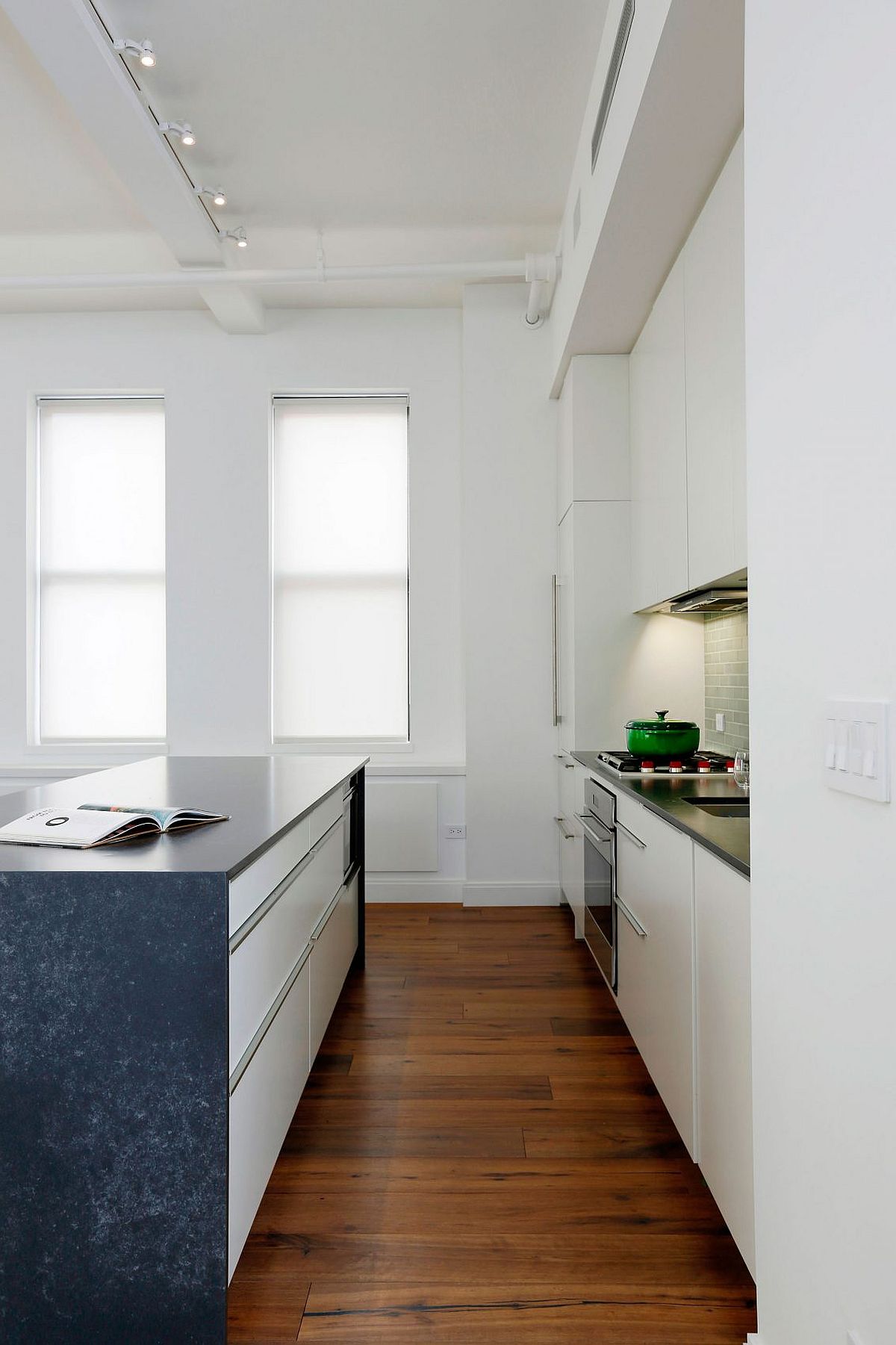 Small kitchen with contemporary island in stone