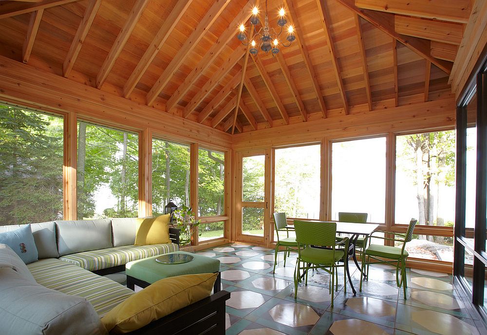 Spacious sunroom with a comfy lounge and dining area