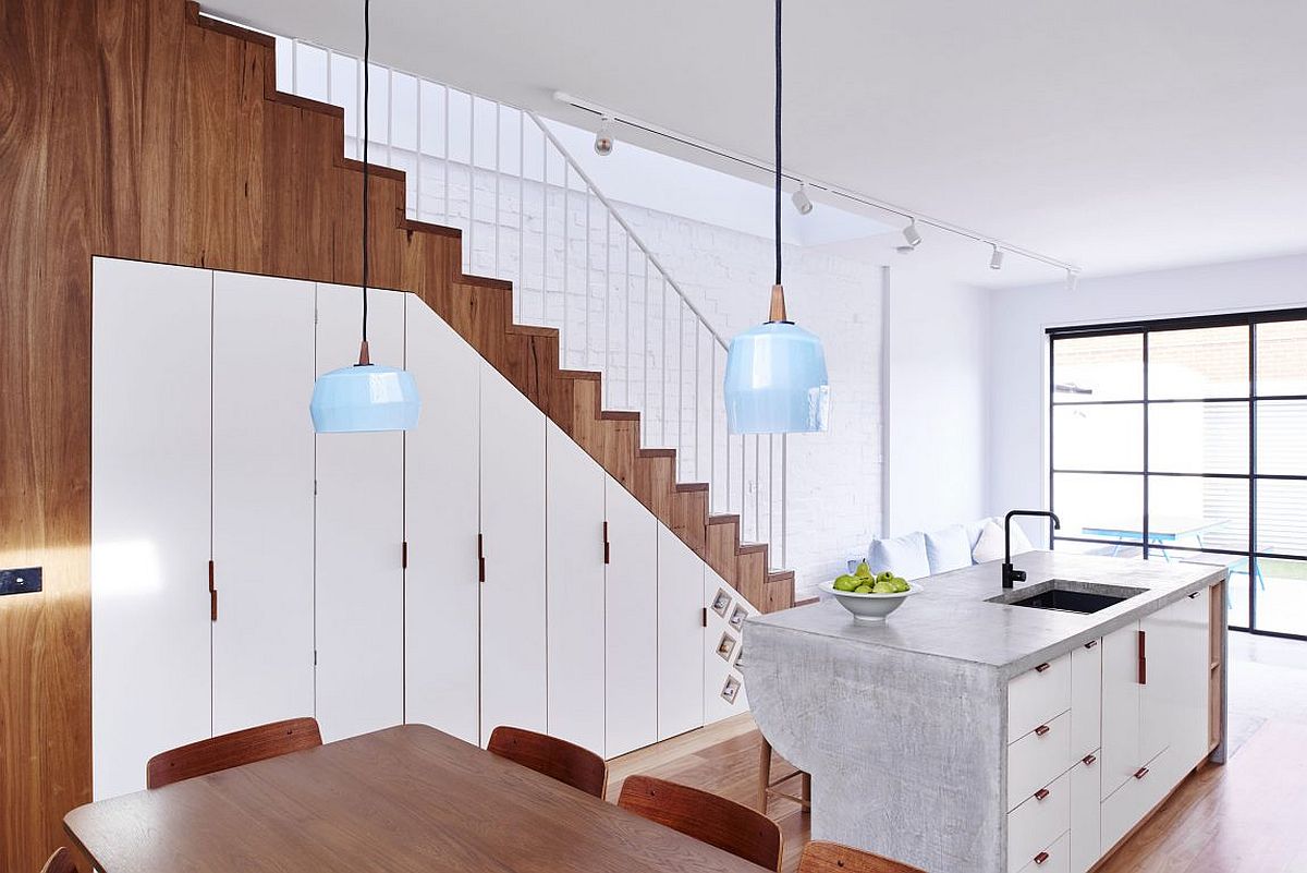 Storage space under the staircase with a series of cabins