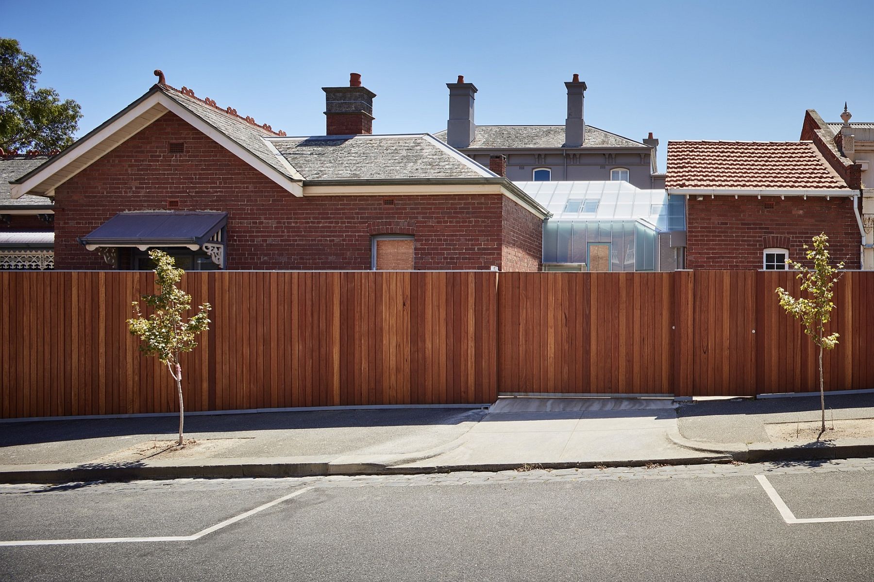 Street view of the transformed home in Melbourne with brick facade