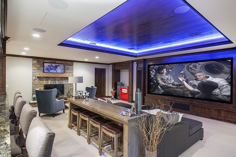 Stunning beach style media room with a home bar