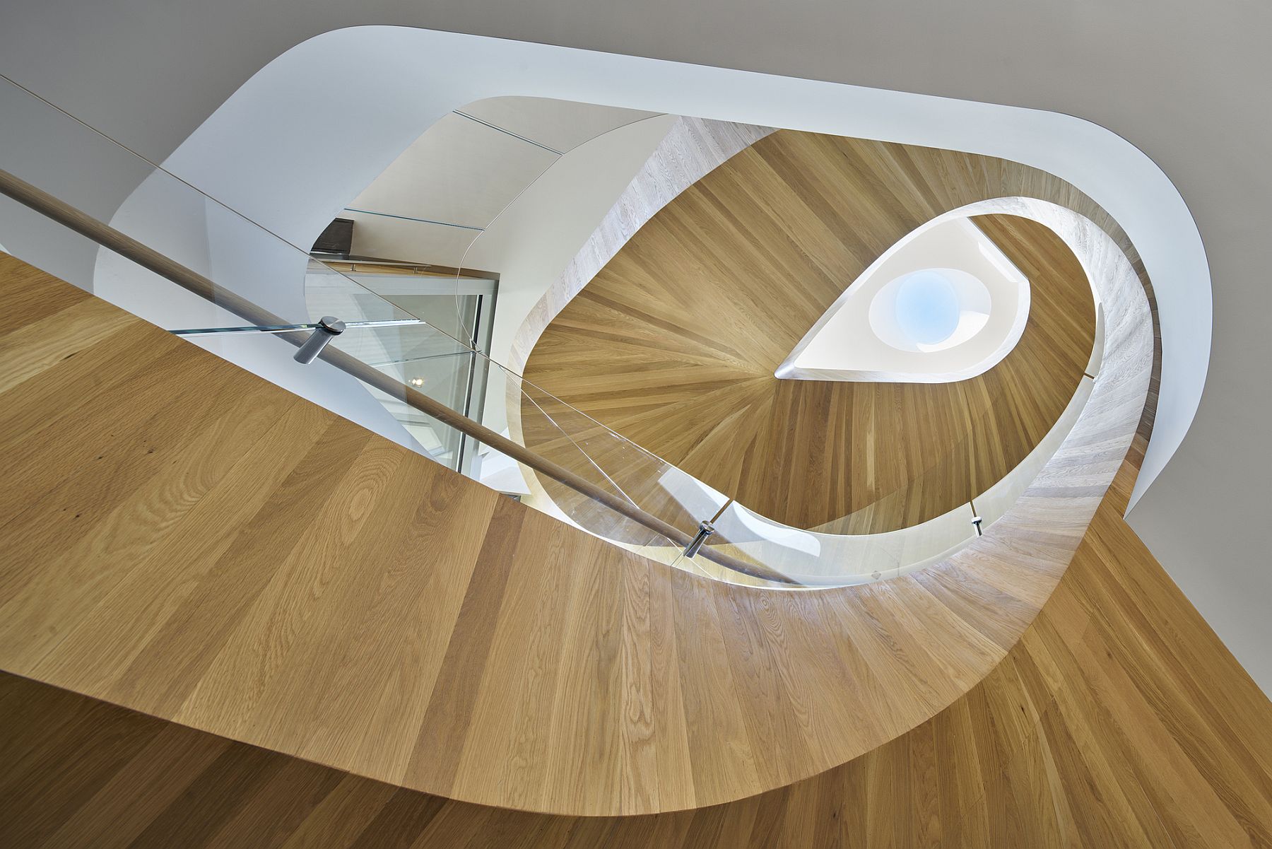 Stunning helical staircase adds grandeur to the interior