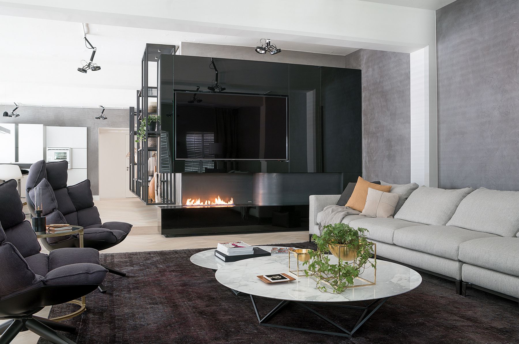 Stunning use of fireplace in the living room with 80-inch TV above it