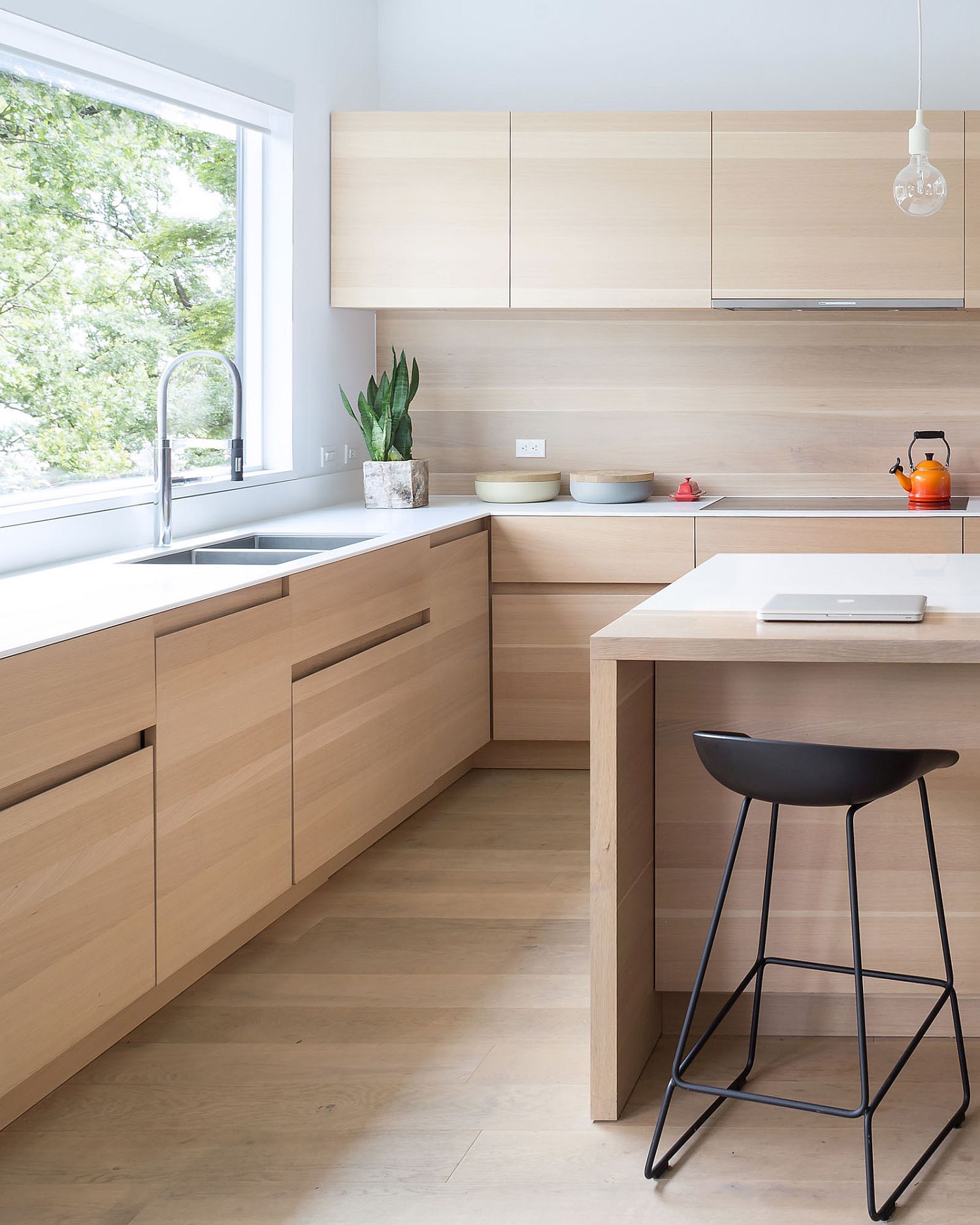 Stylish contemporary kitchen borrows from the aesthetics of an Asian interior