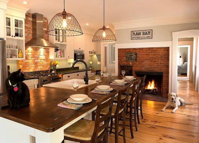 Traditional Brick Fireplace Serves Both The Kitchen And The Breakfast Zone 650x467 