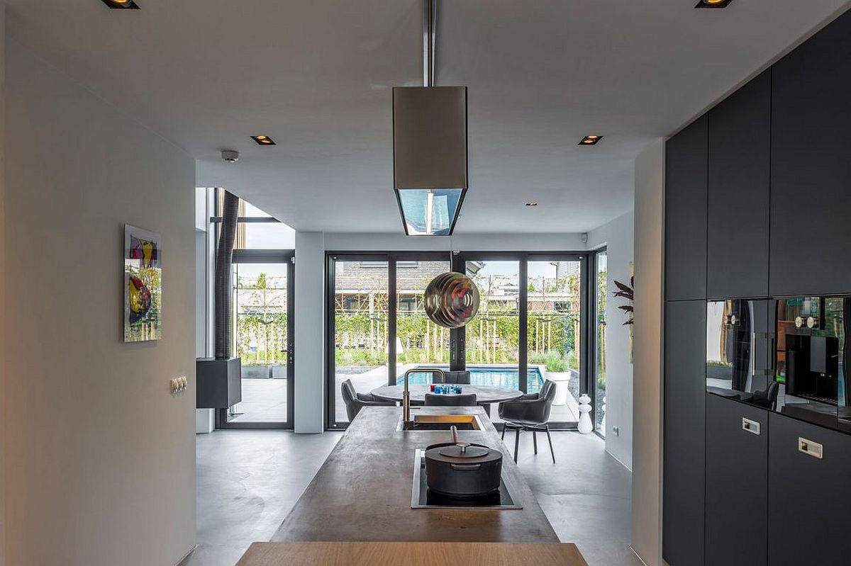 View of the living space and extended outdoor living area from the kitchen