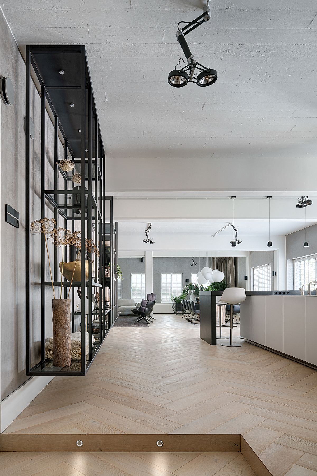 View of the open and airy living area of the Brussles loft that was once a a home office