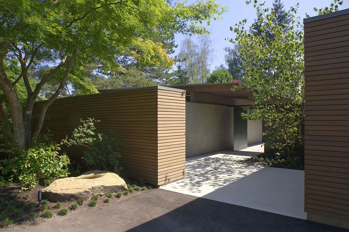 Wood and stone shape the facade of the urban cabin