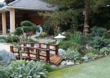 Wooden-bridge-gives-the-Asian-garden-that-timeless-Japanese-style-and-Oriental-vibe-217x155