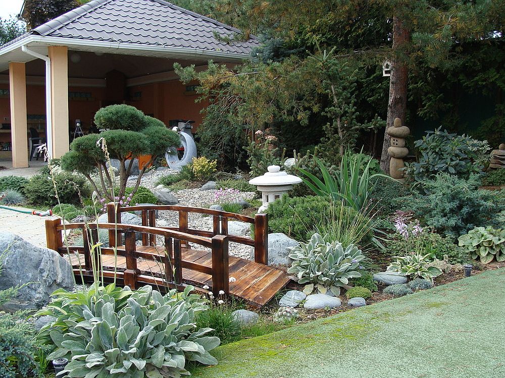 Wooden bridge gives the Asian garden that timeless Japanese style and Oriental vibe [Design: Koreneva]