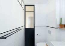 Black-door-offers-contrast-in-the-white-modern-bathroom-217x155