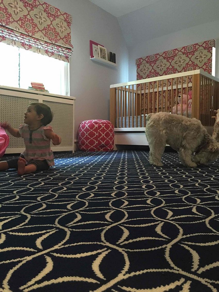 Black rug in the nursery grabs attention despite leaving the color scheme undisturbed [Design: Campbell's Carpet]