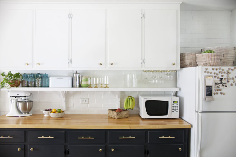 Brass knobs and pulls in a kitchen makeover