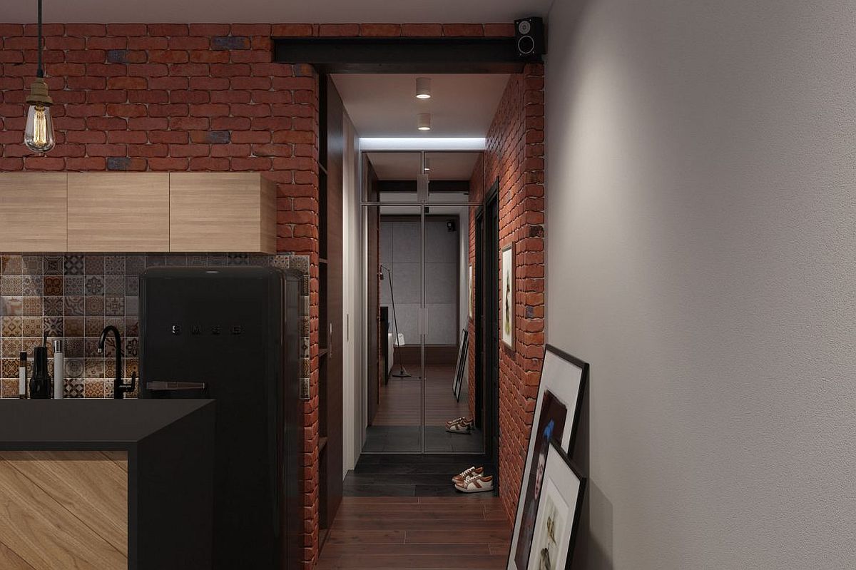 Brick, wood and natural stone shape the stylish and space-savvy bachelor loft