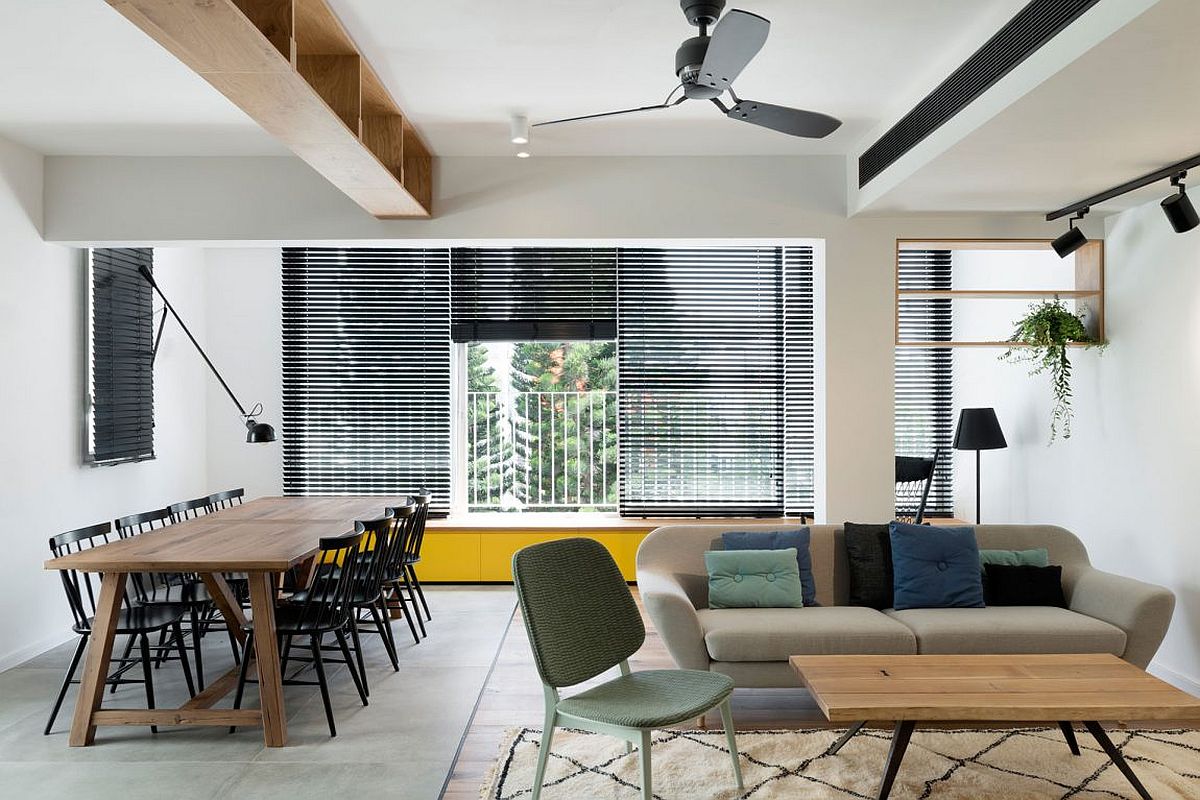 Cabinets at the top of the room offer additional storage and display space