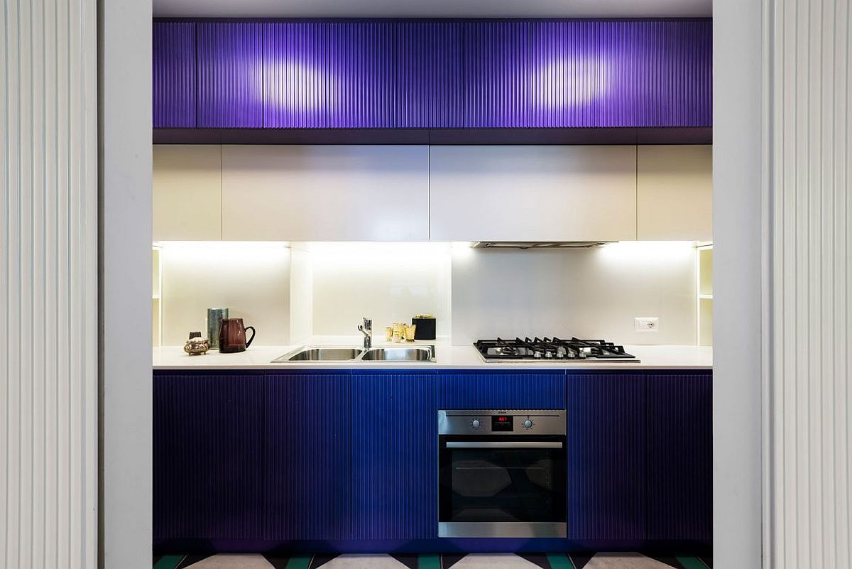 Cabinets give the kitchen a bright, blue visual appeal