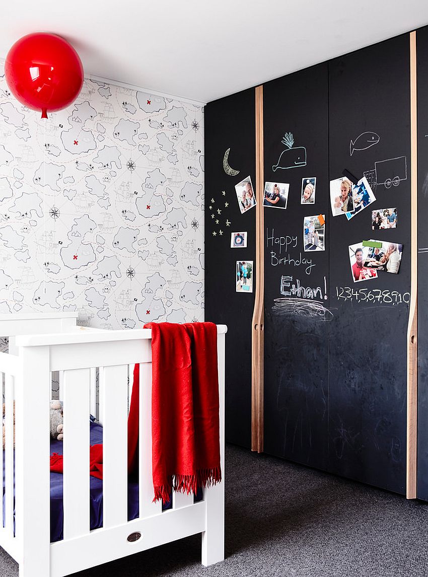 Chalkboard wall is the perfect way to add color to the contemporary nursery [Design: Atticus & Milo]