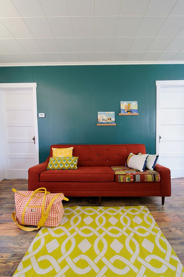 Chic eclectic living room with bright red sofa [Design: Sarah Phipps Design]