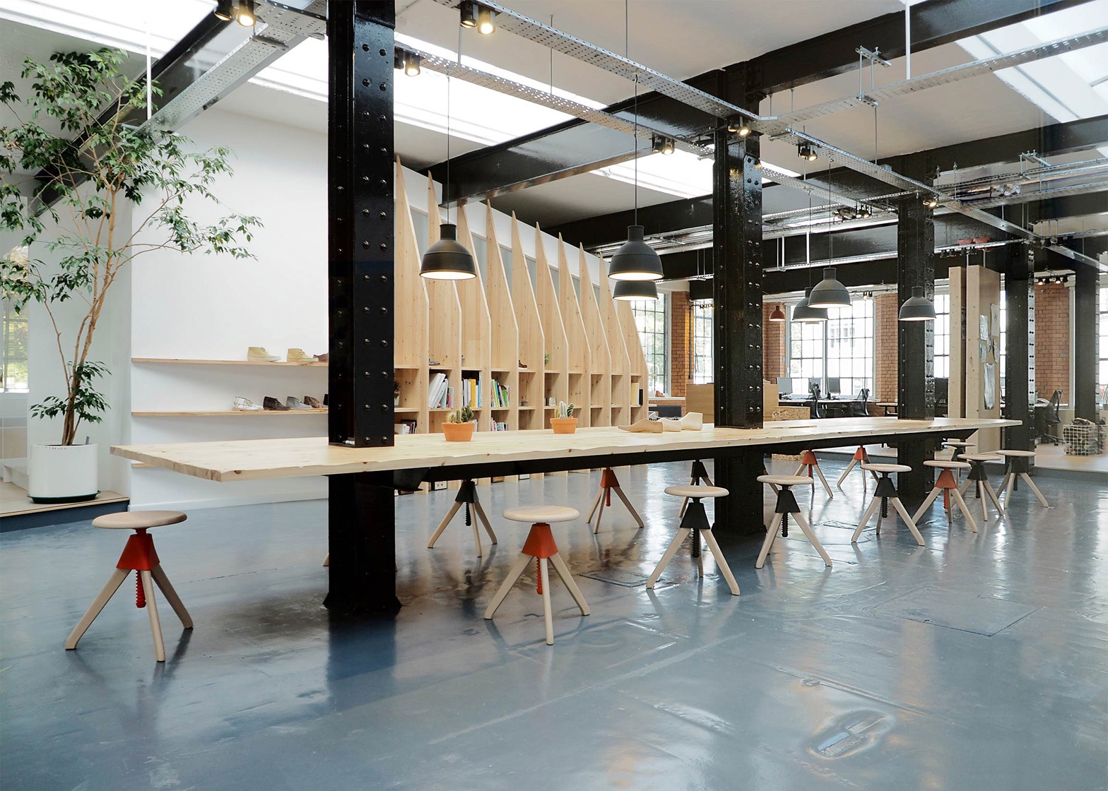 Paris-based ARRO Studio transformed a 19th-century warehouse into a modish design studio for trusted British shoe brand Clarks. Image via Dezeen.