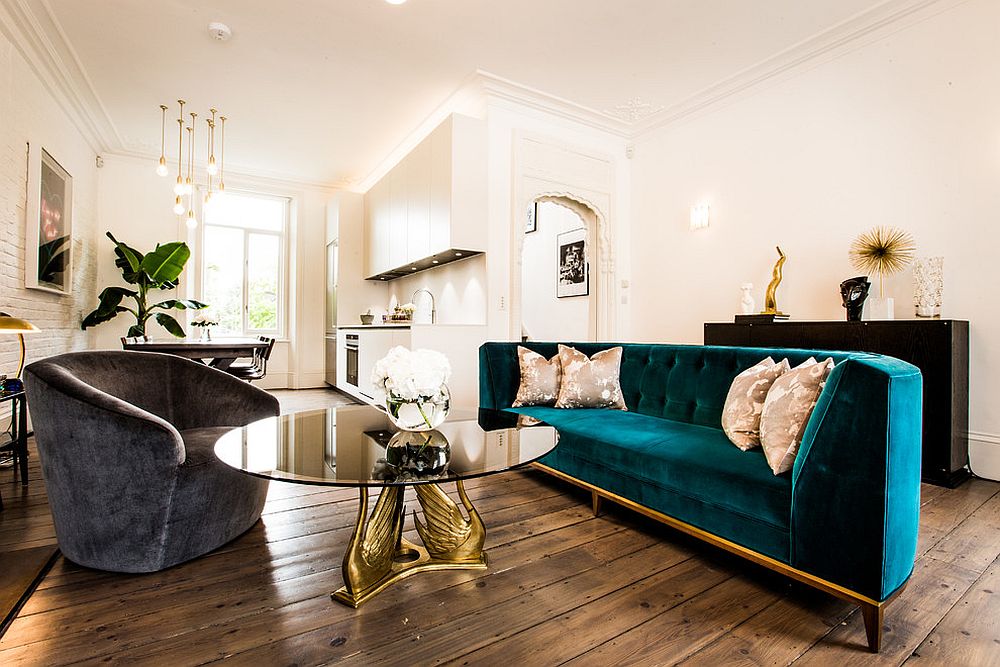 Classic midcentury living room with couch in velvety blue and gold