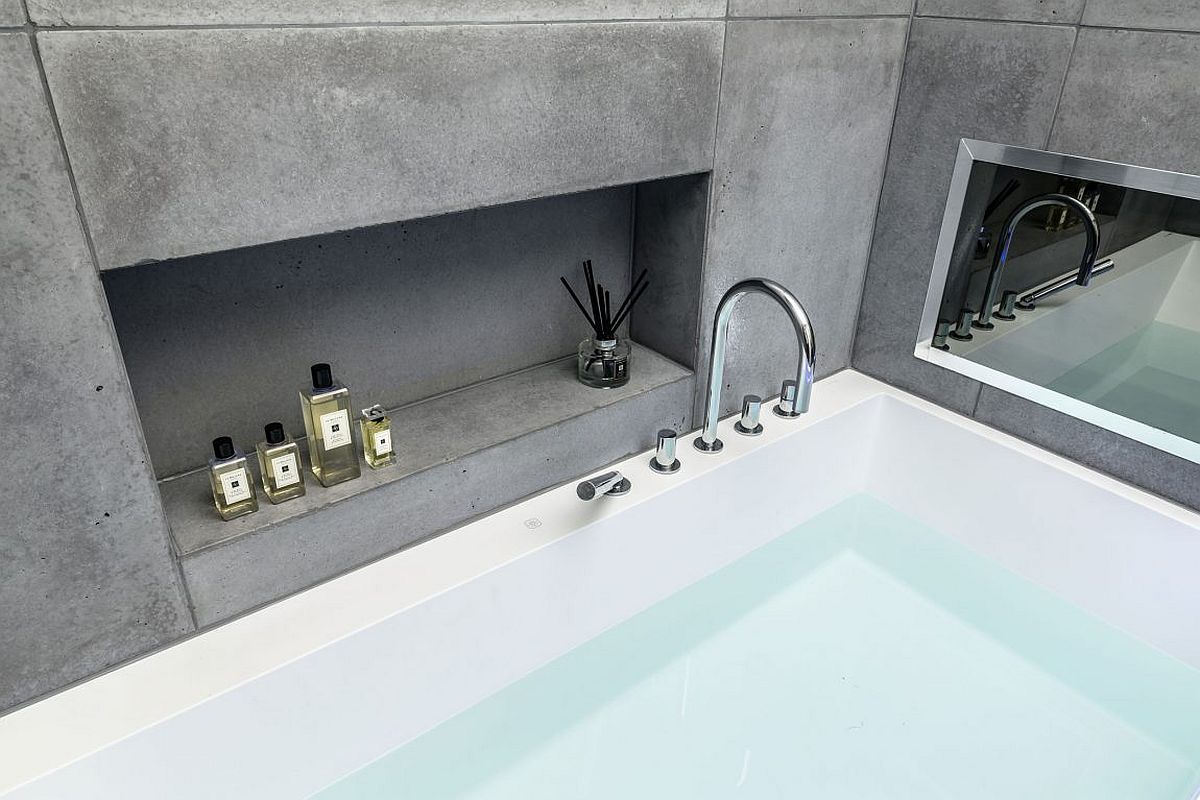 Concrete tiles and smart design create a soothing cotemporay bathroom inside the London penthouse