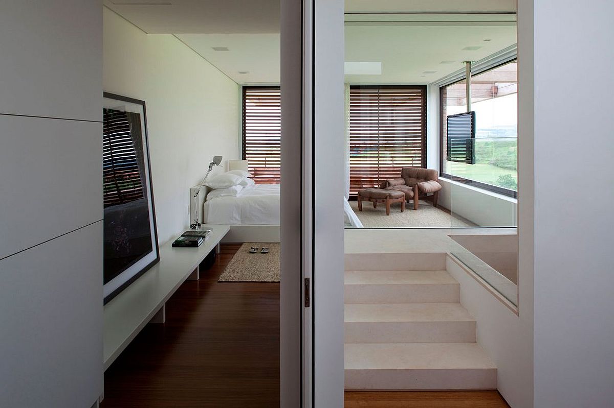 Contemporary bedroom in white connecetd with the pergola and landscape