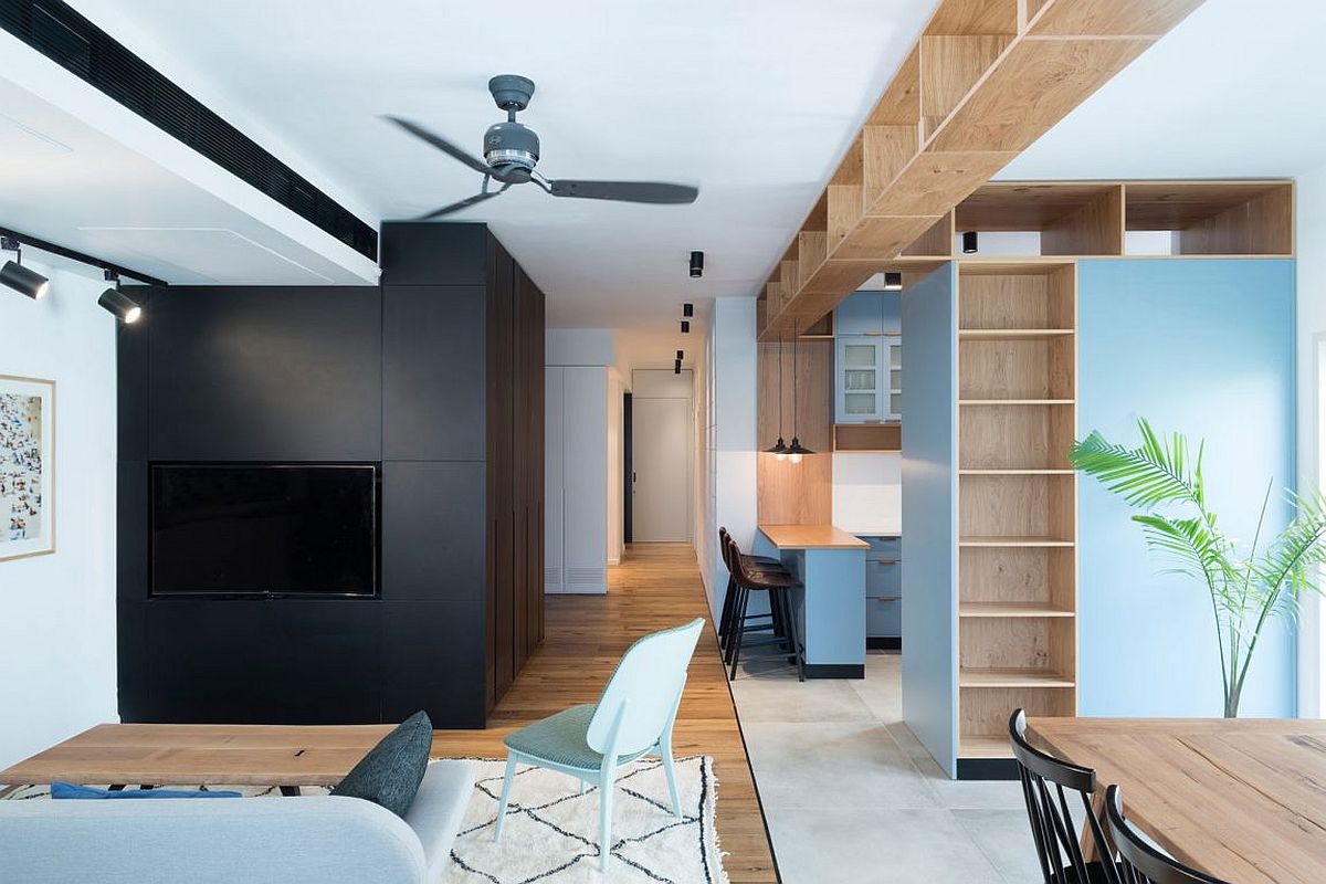 Custom cabinetry in the living room provides additional storage space