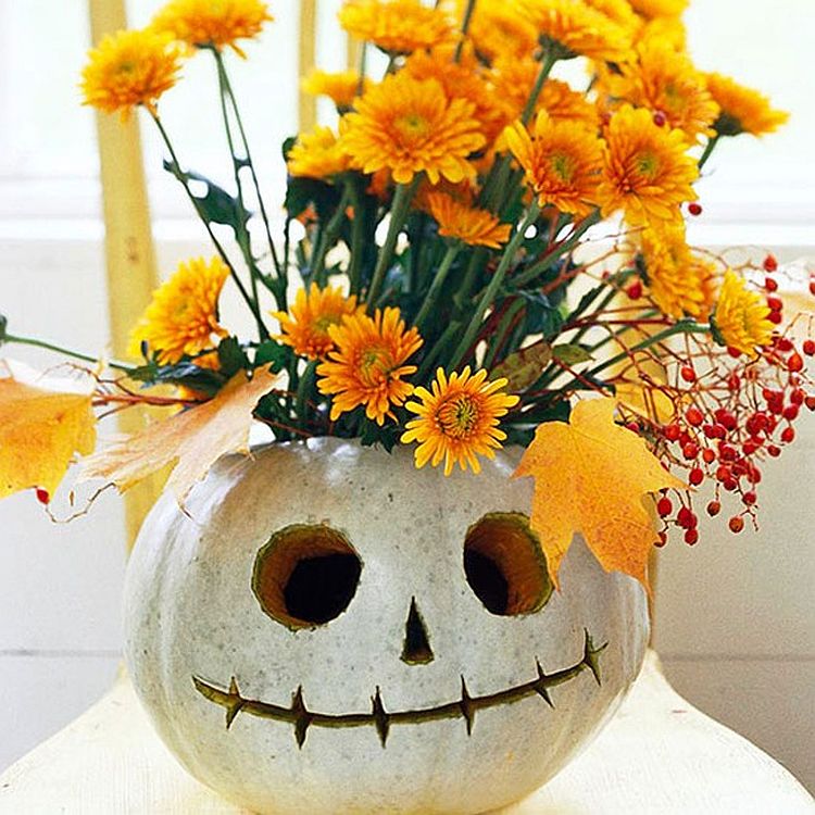 Delightful way to combine colors of fall with pumpkin carving