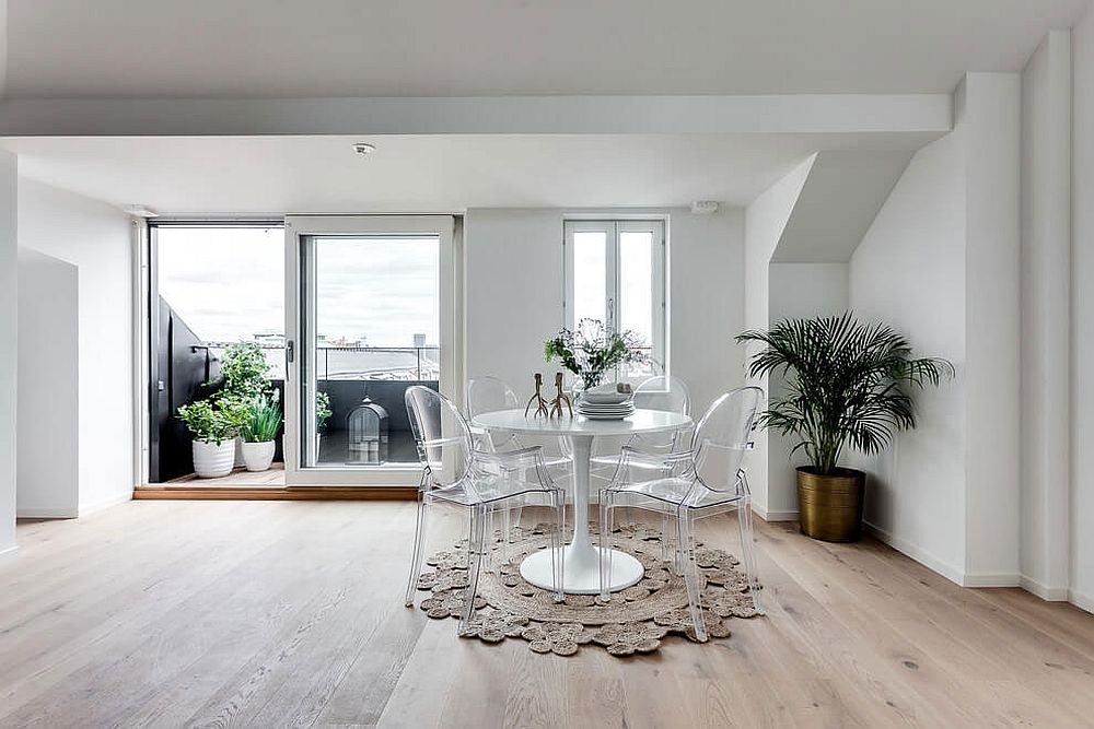 Dining area and balcony of the small attic apartment in Stockholm