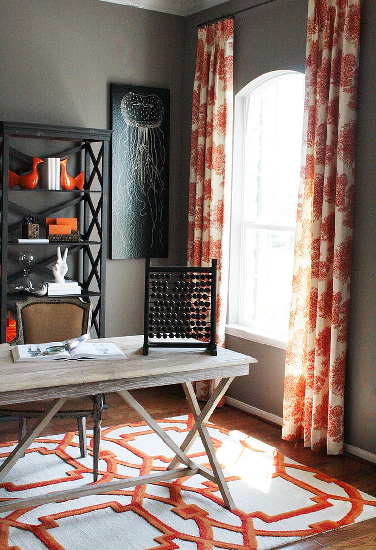 Drapes and rug bring orange to the home office in gray [Design: Cristi Holcombe Interiors]