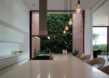 Edison-bulbs-and-exposed-brick-walls-give-the-interior-a-subtle-industrial-touch-217x155