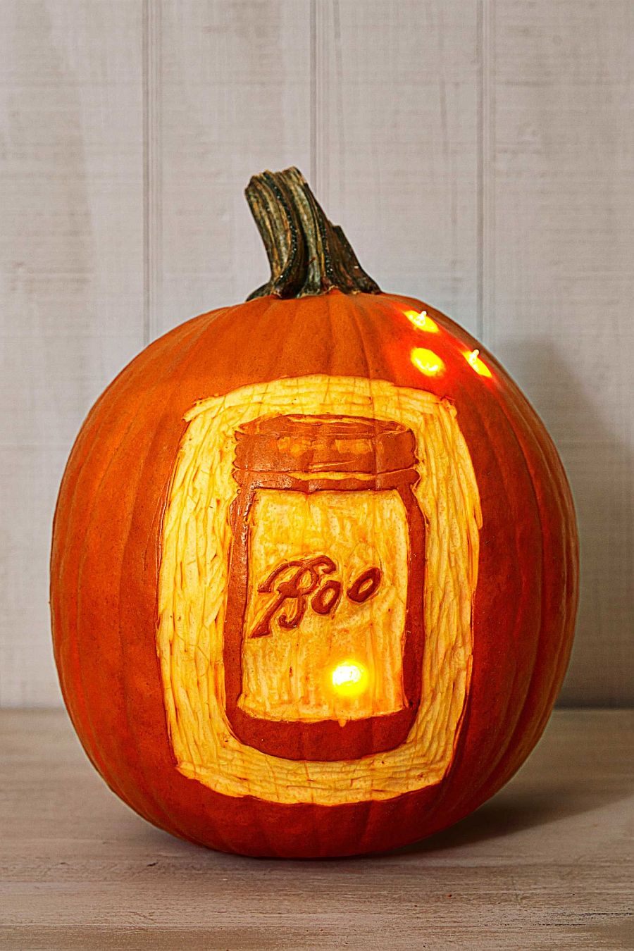 Elegantly lit Mason Jar Pumpkin brings that classic country charm ro your Halloween decorating