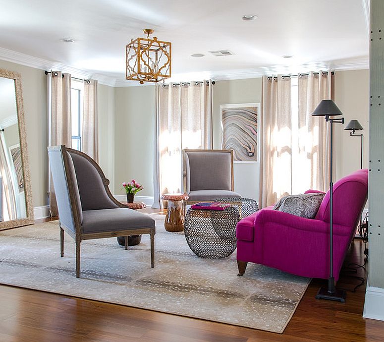 Fabulous sofa in bright fuchsia adds color and cheerful glam to the living room in gray [Design: Valorize Hart]