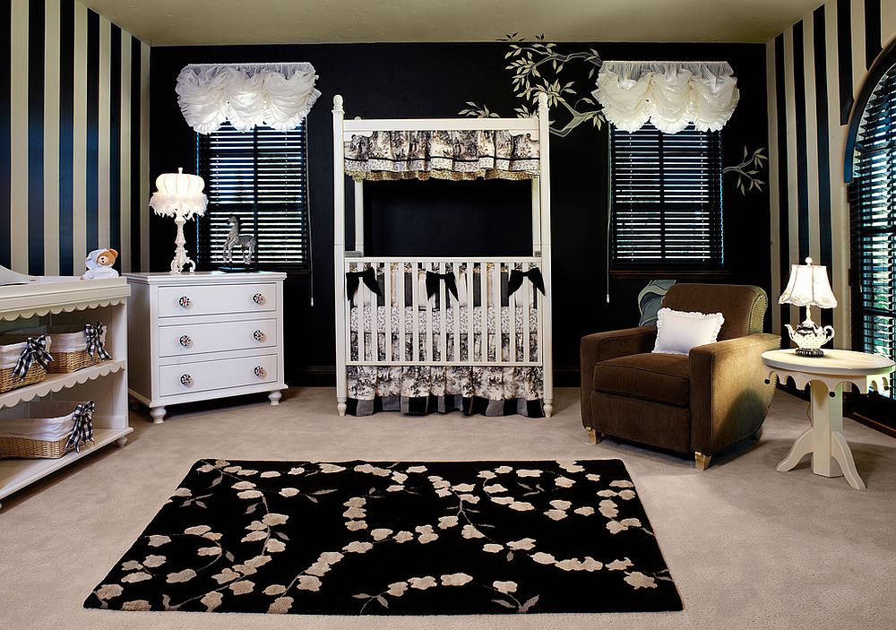 Fabulous transitional nursery in black and white with striped walls and black rug