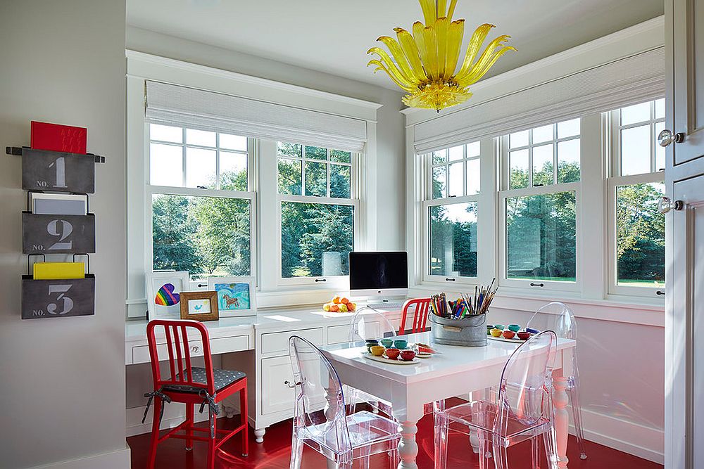 Flooring and chair enliven the gray home office with a splash of red