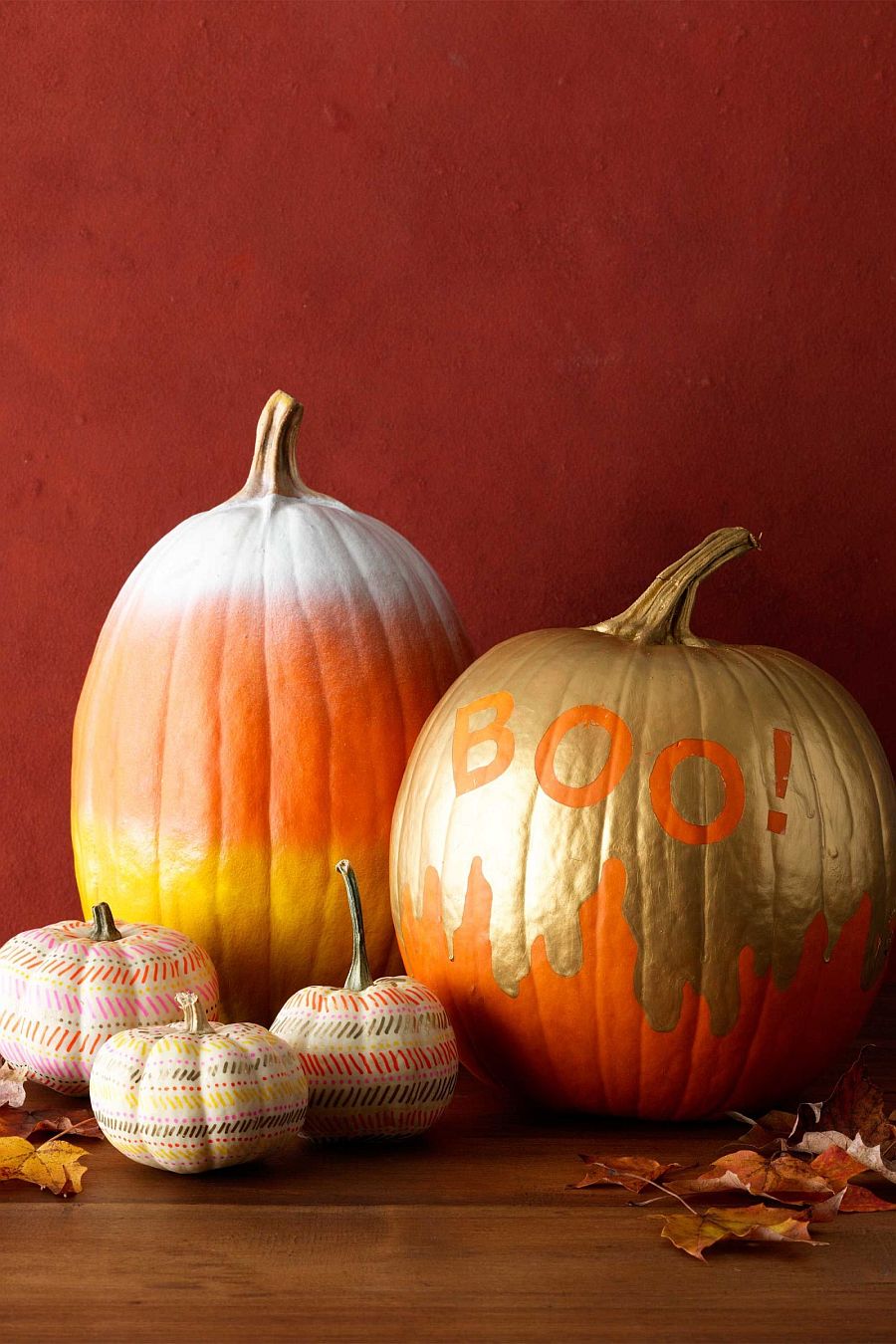 Gold and orange definitely give the spray painted Halloween pumpkin a cool look