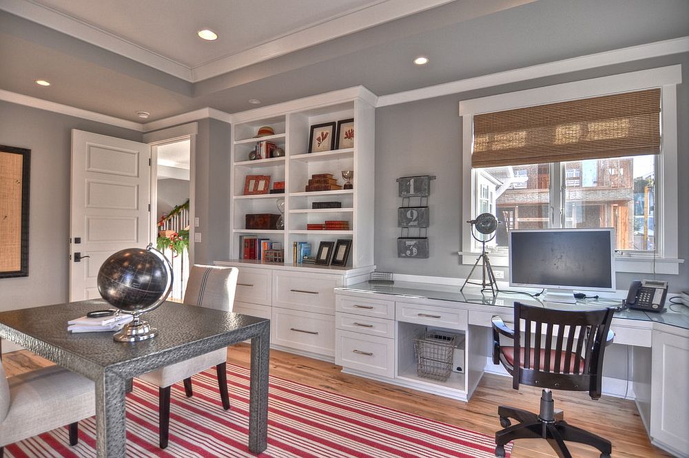 Gorgeous striped rug in red brings color to this traditional home office in gray