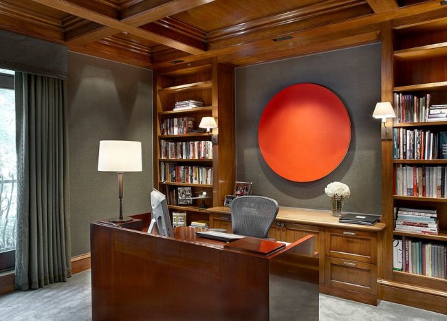 Gray Upholstered Walls Are Brought Alive With Unique Orange Artwork Addition 650x467 