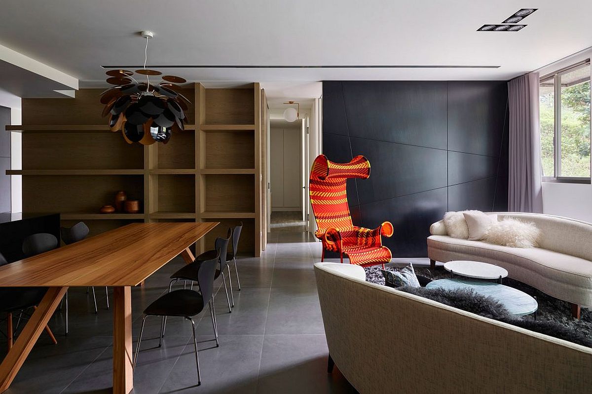 Gray, white and black give the living room a neutral backdrop that lets bright accents to shine through