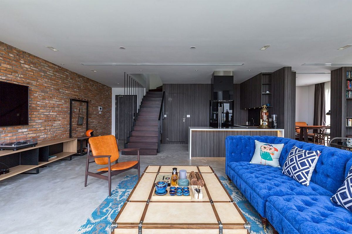 Gray wooden panels cover the kitchen at the penthouse