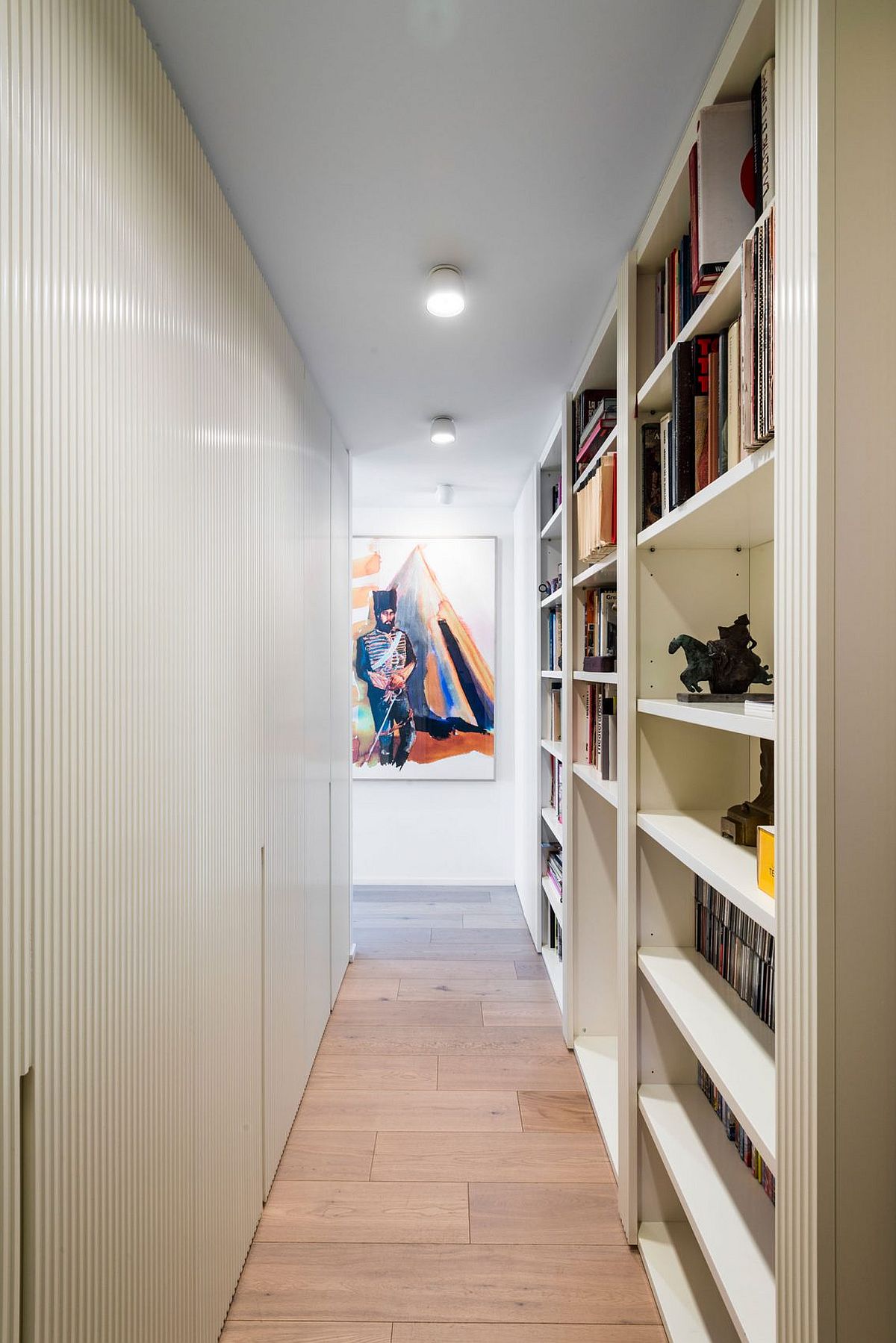 Hallway and corridor with bookshelves offers additional storage space